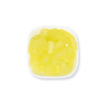 Close-up of pineapple coconut jelly strip, featuring a vibrant yellow color and crunchy, chewy texture.
